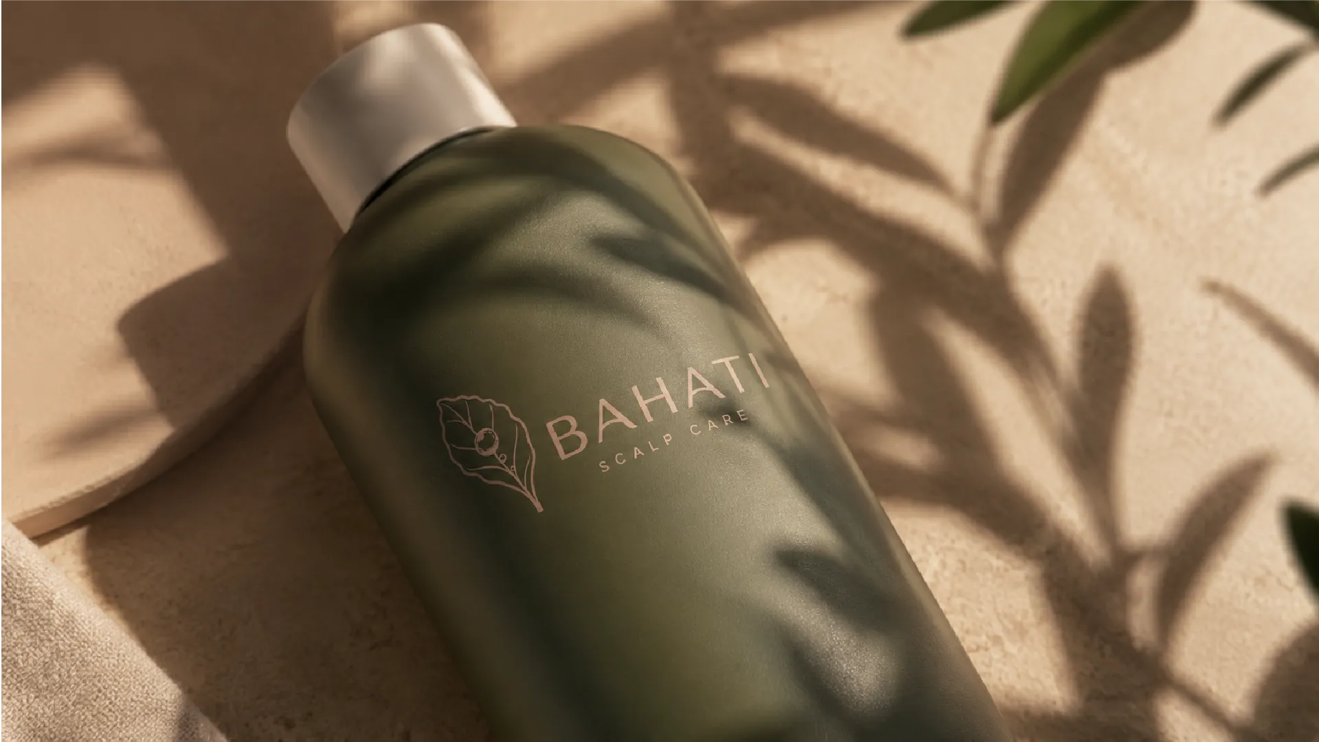Close crop of Bahati green product bottle